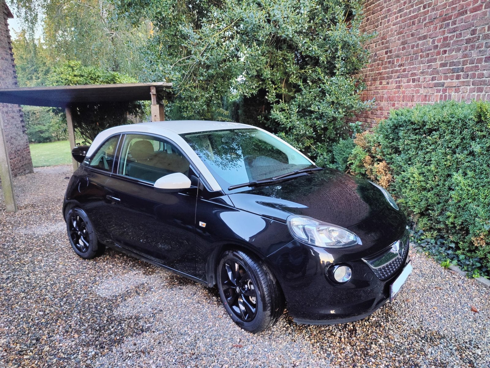 Opel Adam 1.2 benzine (2018) - tweekleurig - 109.825, Voorwielaandrijving, 4 zetels, 4 cilinders, Zwart