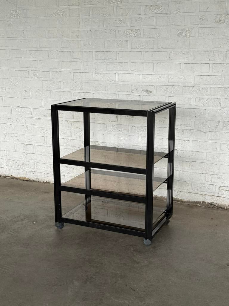 Meuble desserte vintage en verre fumé et métal noir an 70/80, Huis en Inrichting, Kasten | Stellingkasten, Gebruikt, Ophalen