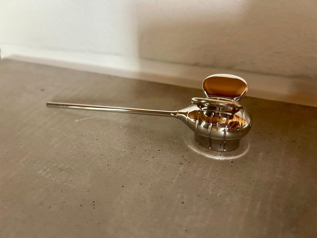 Alessi Bzzz Kaarsendover, Ophalen