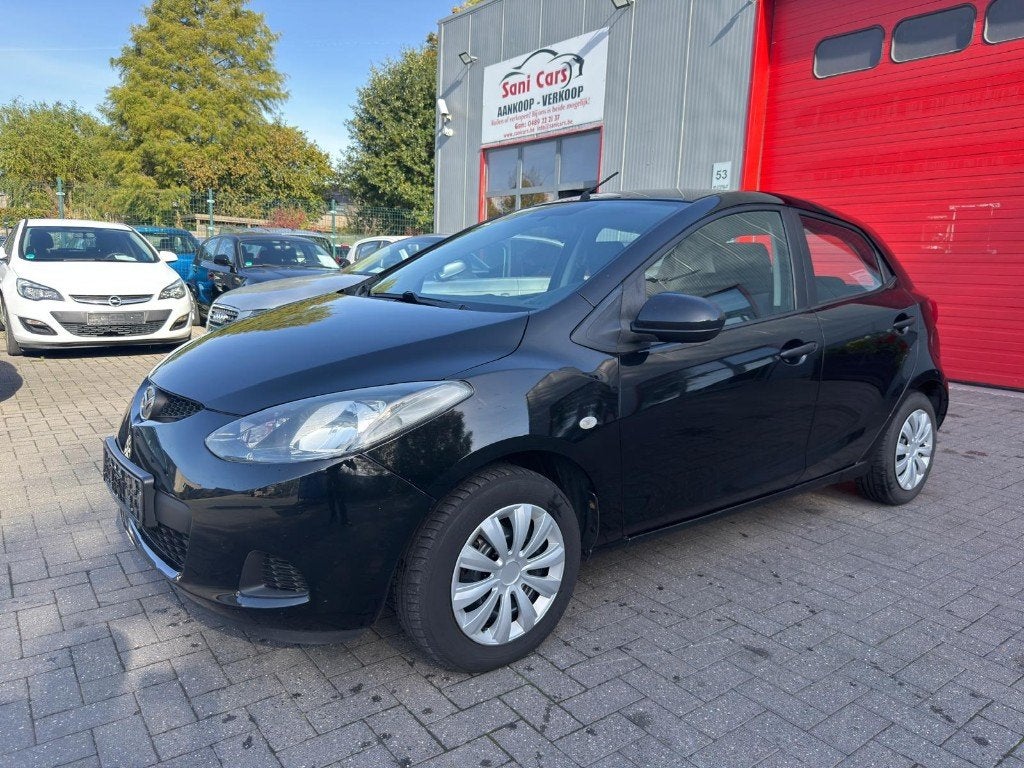Mazda 2 1.3 benzine bouwjaar 2009 153000 km goede staat, Auto's, Voorwielaandrijving, https://public.car-pass.be/vhr/a9f7e472-1064-4b27-8379-0640822c67f5