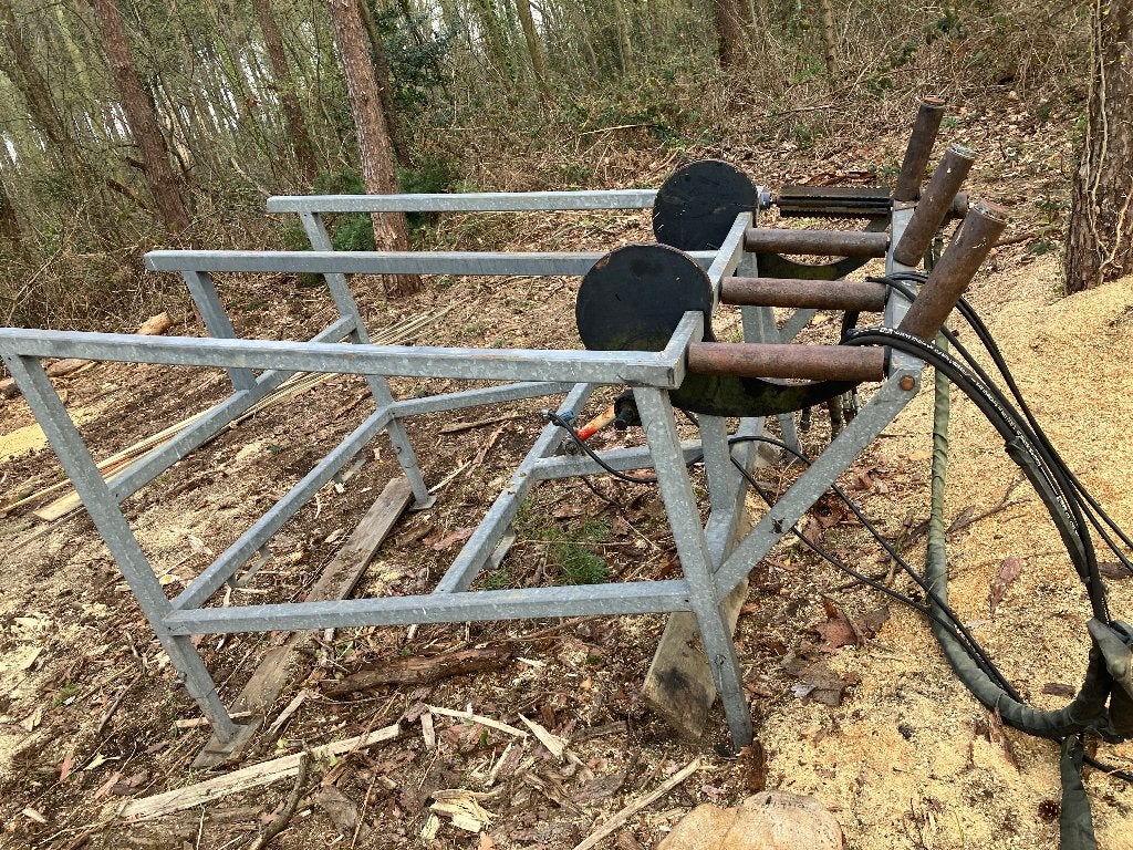 Aanvoertafel stammen zaagkloofmachine, Ophalen