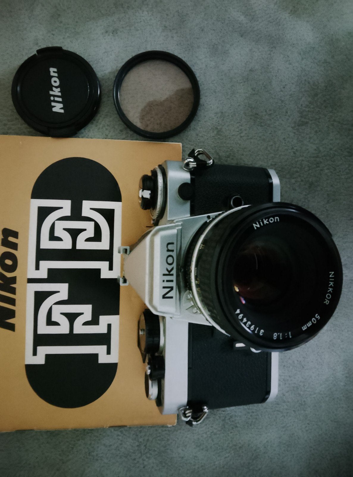 Nikon FE body, Nikkor 50mm 1:1.8 lens, handleiding, het werk, Audio, Tv en Foto, Ophalen of Verzenden, Zo goed als nieuw, Spiegelreflex