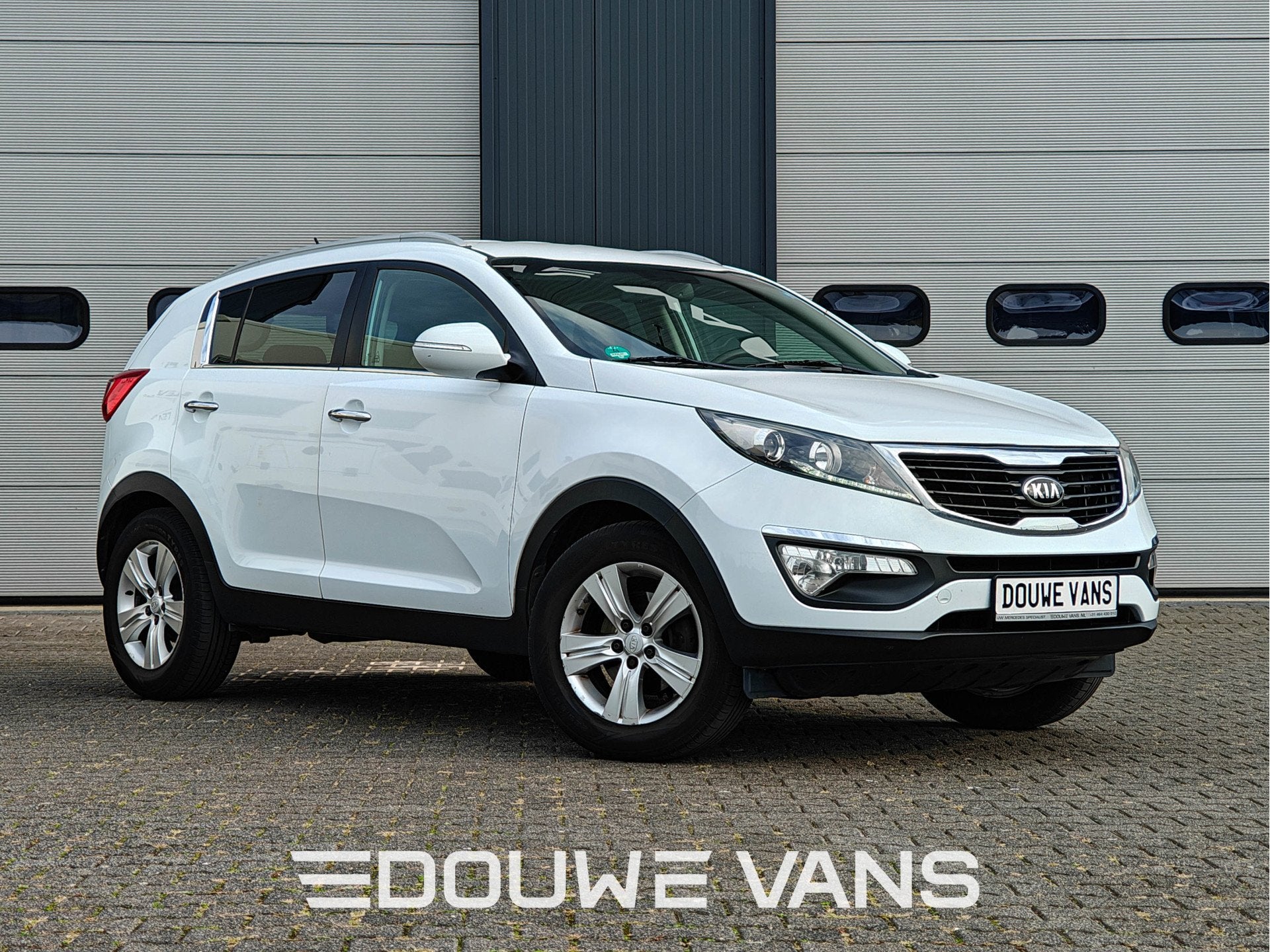Kia Sportage 1.6 Attract Airco Trekhaak Cruise Control PDC, Stof, 4 cilinders, 149 g/km, Wit