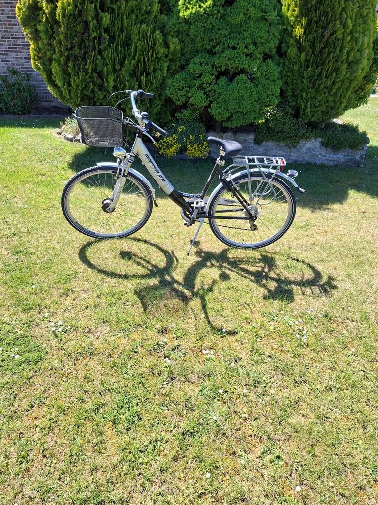 Damesfiets., Ophalen