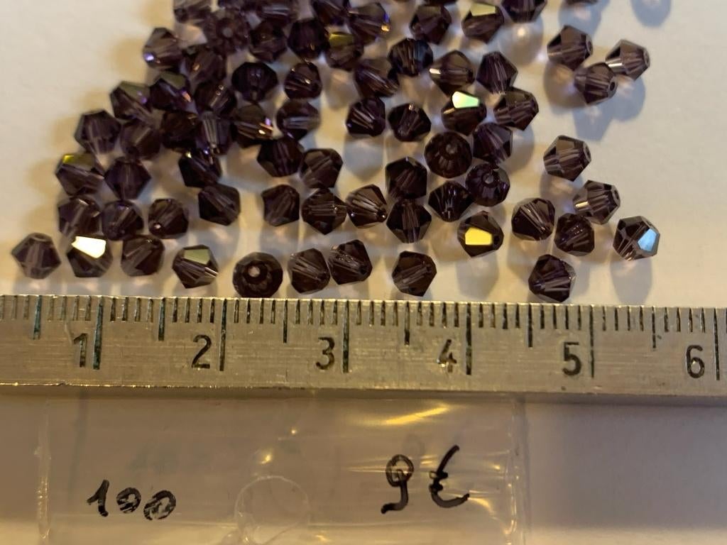 100 Swarovski tolletjes donker amethist, Ophalen of Verzenden, Nieuw, Kraal