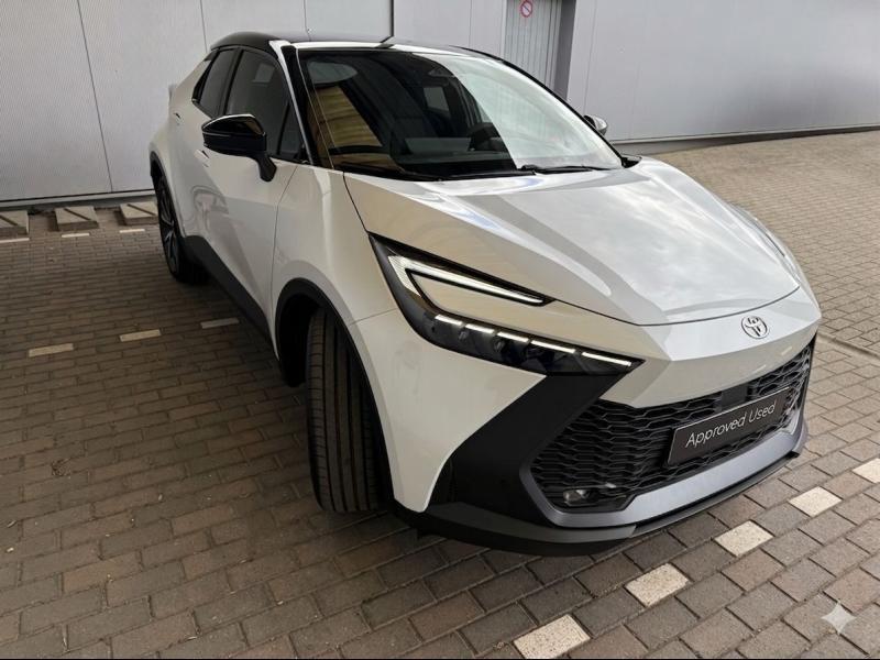 Toyota C-HR Dynamic Plus Bi-Tone Techno Pack, Auto's, Toyota, Automaat, 72 kW, Wit, Hybride Elektrisch/Benzine