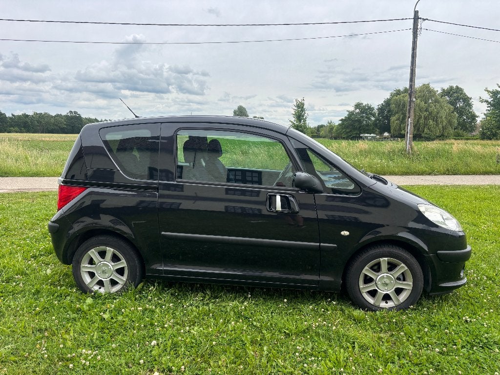 Peugeot 1007 1.4i AUTOMAAT 127.000km AIRCO alle LEZ, Auto's, Stof, 4 cilinders, 149 g/km, Zwart