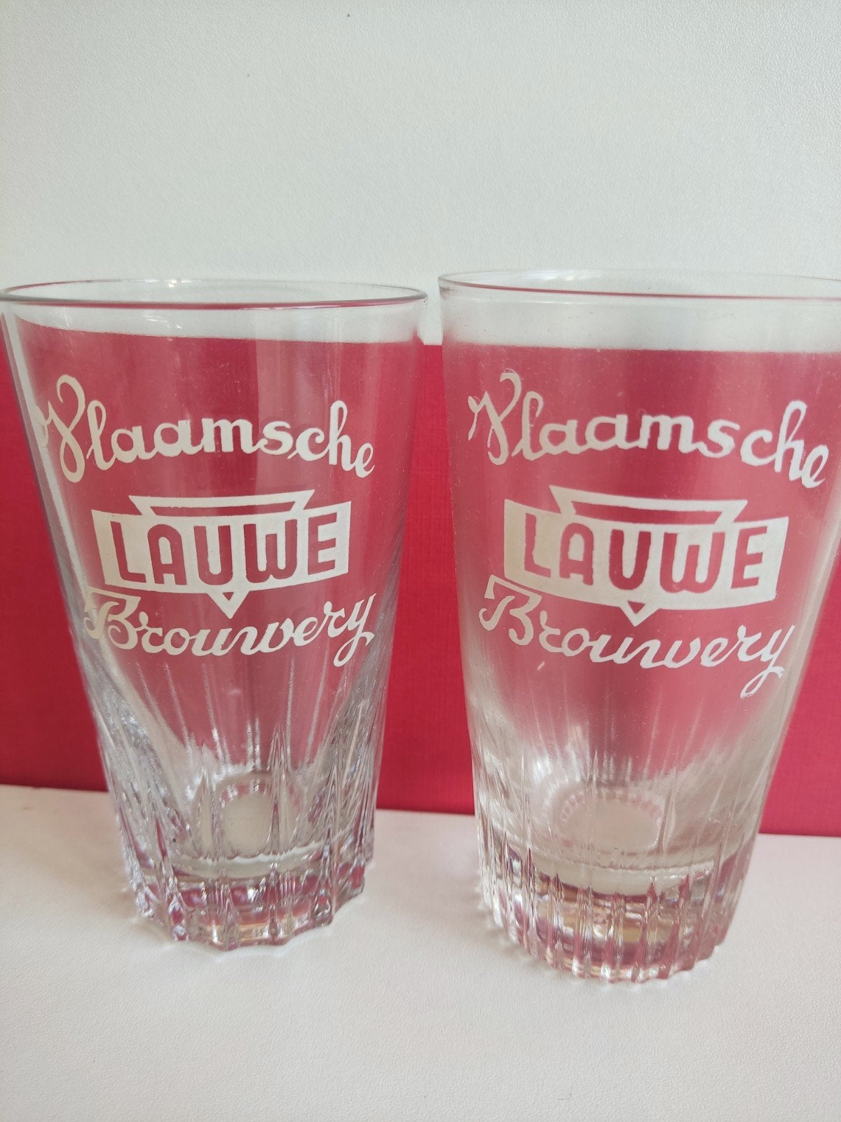 2 vieux verres à bière différents | Vlaamsche Brouwerij Lauw, Enlèvement, Comme neuf, Verre à bière