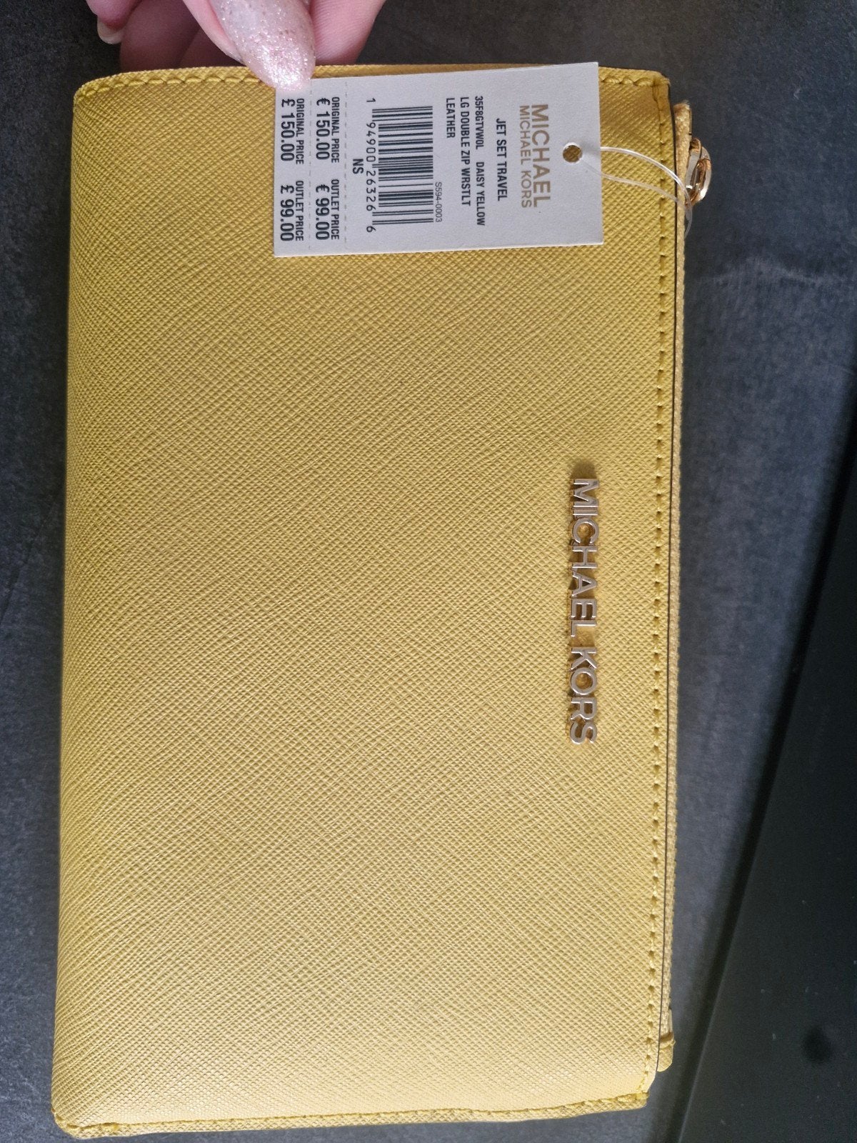 Nouveau portefeuille Michael Kors, Enlèvement