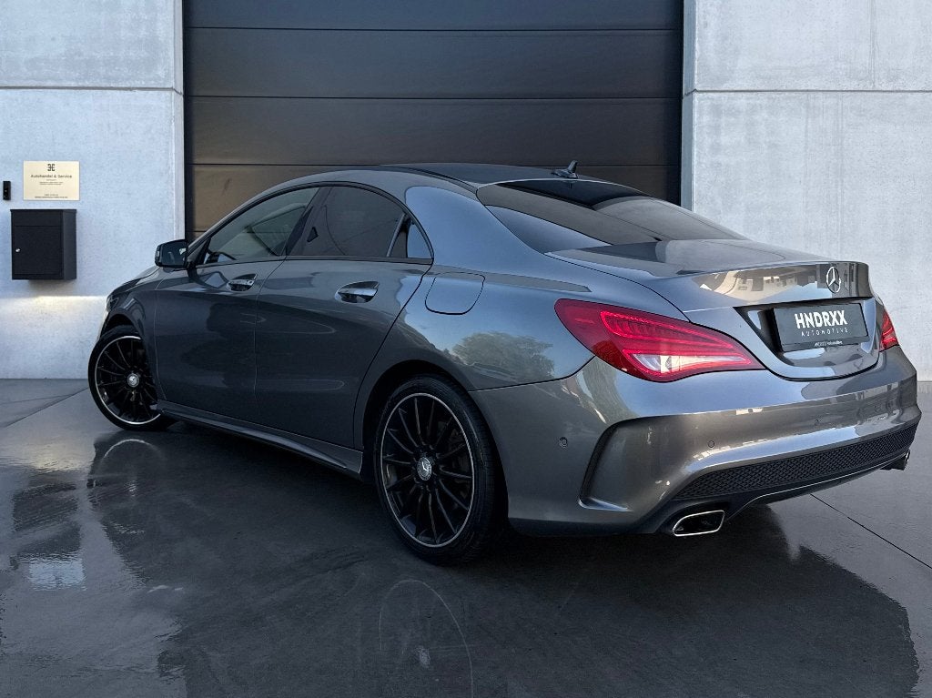 Mercedes CLA 250 4MATIC AMG Line | Leder | H&K | Camera, Auto's, Automaat, CLA, 4 cilinders, Zwart