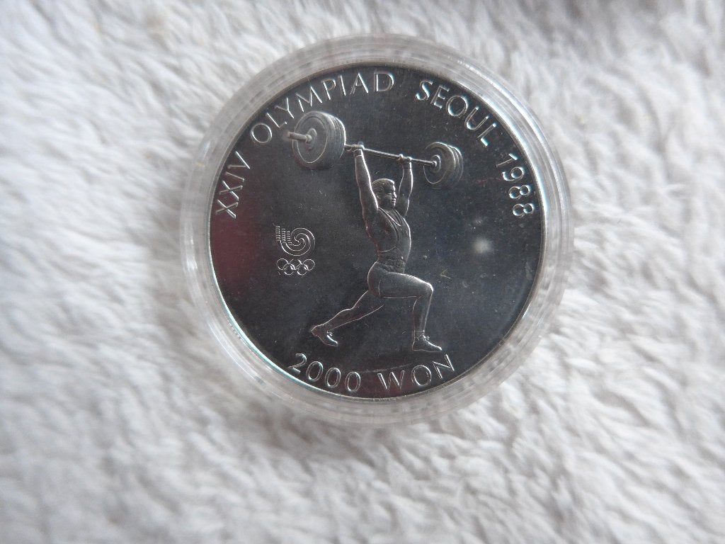 Pièce d'haltérophilie des Jeux Olympiques de Séoul 1988, Enlèvement ou Envoi