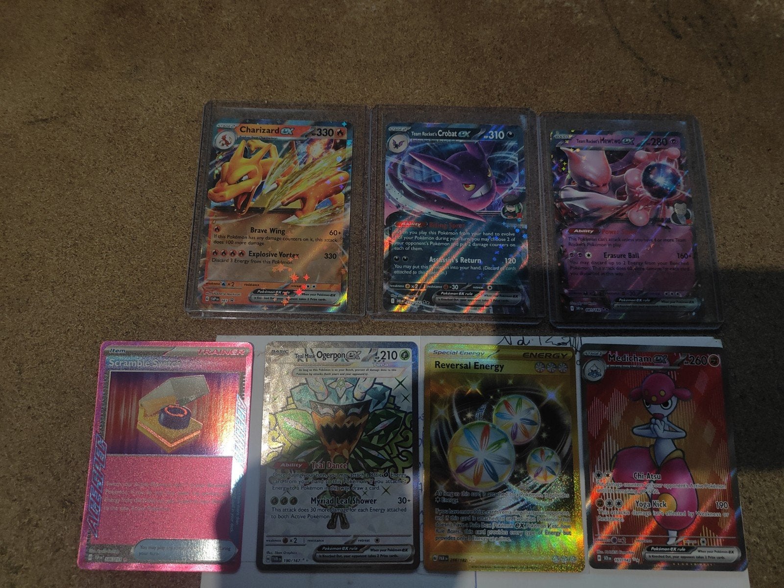 12 pokemon kaarten,+ beeld sharrizard lot 55 eu, Ophalen of Verzenden