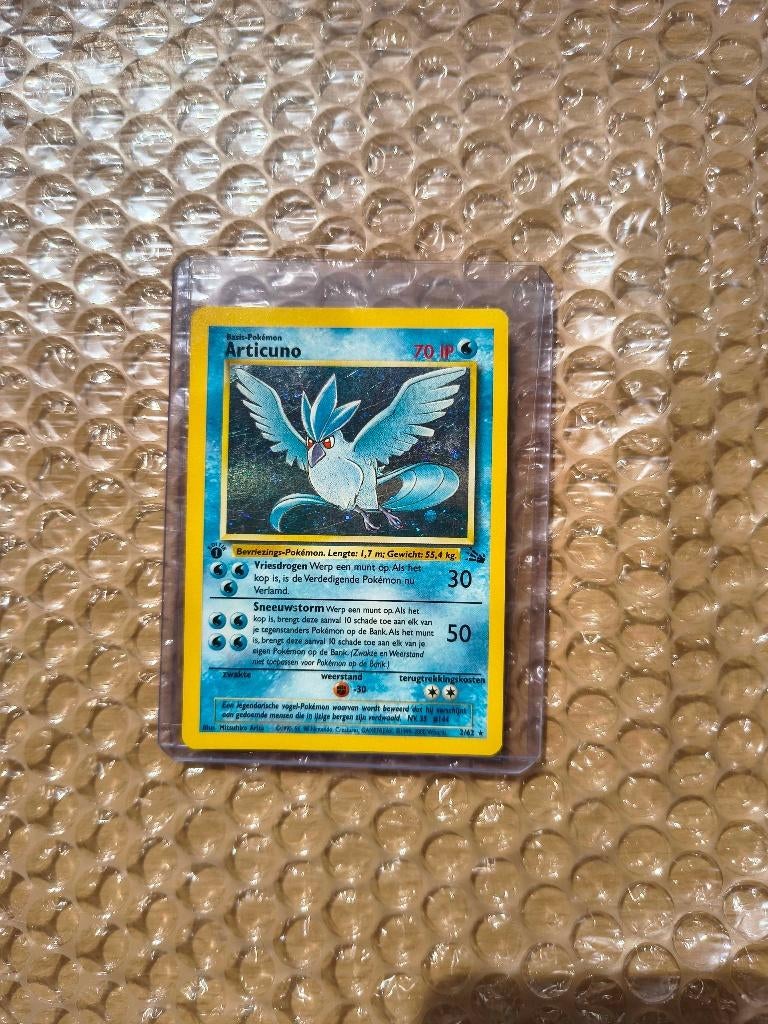 Pokemon Articuno Nederlands Fossil 1st edition, Ophalen of Verzenden, Gebruikt, Losse kaart, Foil