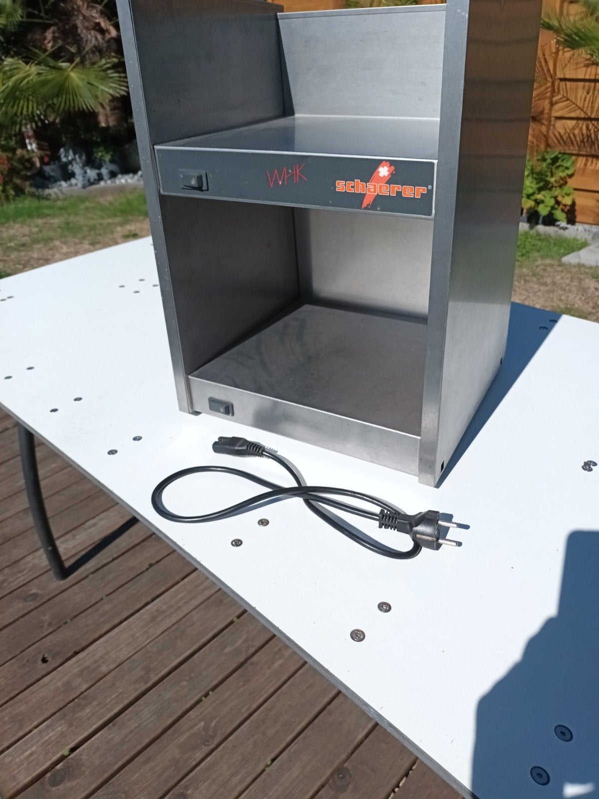 koffiekop verwarmer, Ophalen