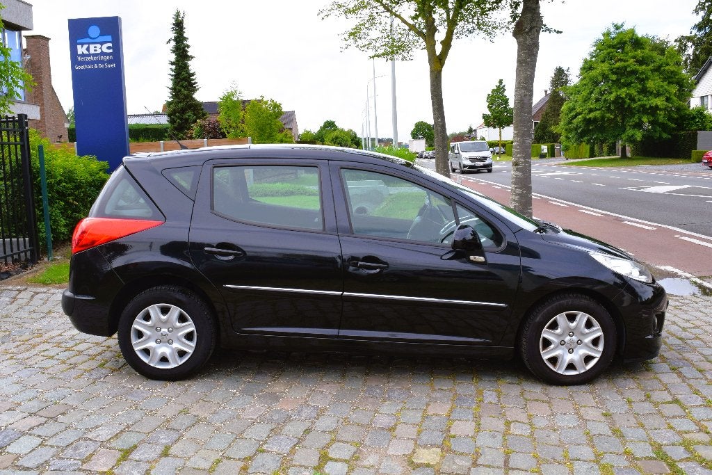 Peugeot 207 SW 1.4i/PANO/AIRCO/HISTORY/GARANTIE, Auto's, Voorwielaandrijving, Euro 5, Stof, Zwart