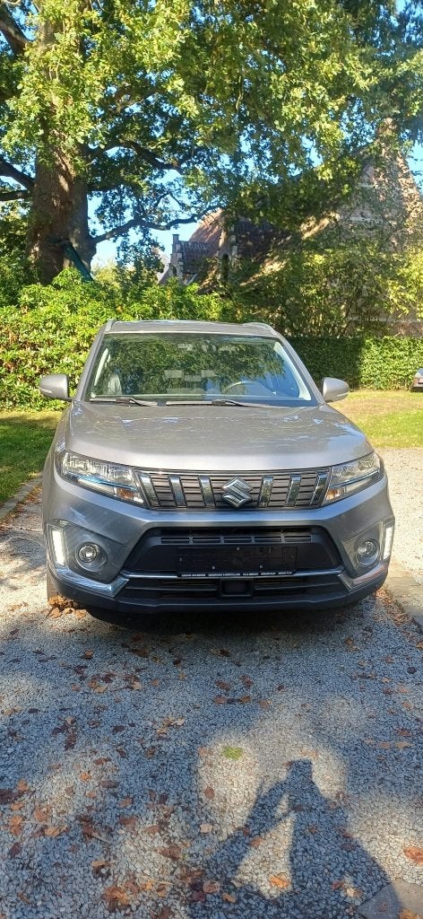 SUZUKI VITARA 1.4 TURBO BOOSTERJET 48V HYBRIDE 4WDGL AT 2021, Auto's, Voorwielaandrijving, Leder en Stof, Beige, Bedrijf