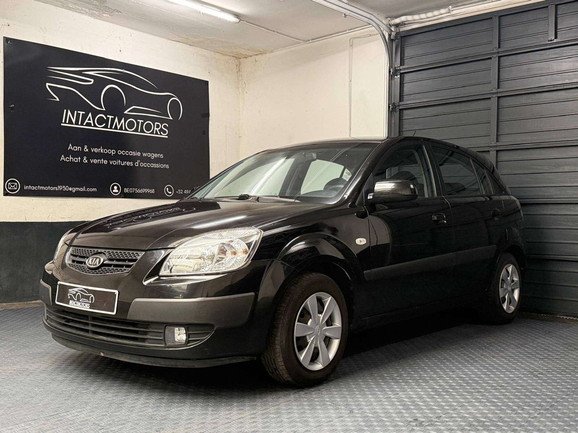 Kia Rio 1.4i LX Airco, Autos, Entreprise, Capteur de stationnement, Boîte manuelle, Noir