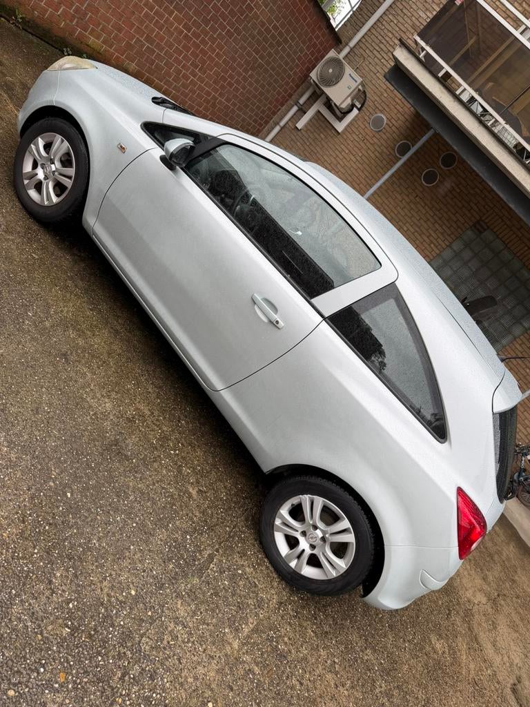 Opel Corsa - Benzine - 1.2L - EXPORT, Auto's, Voorwielaandrijving, Stof, Zwart, 1229 cc