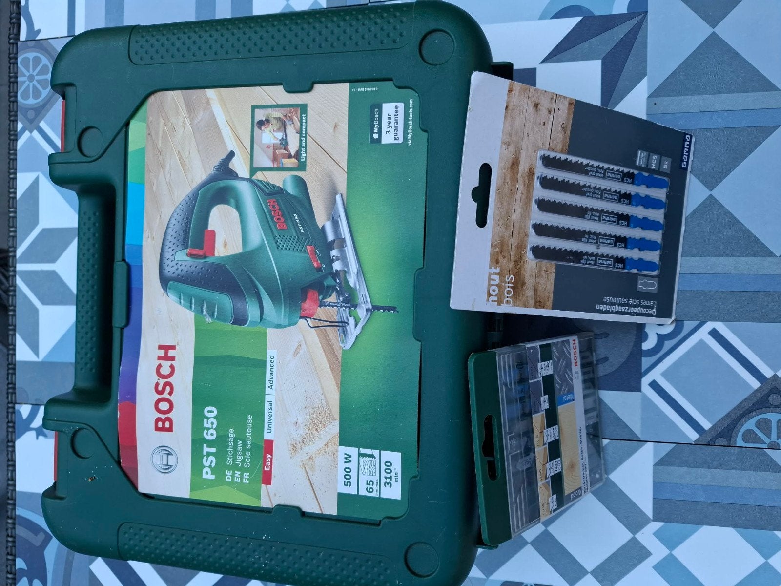 Bosch decoupeerzaag, Ophalen