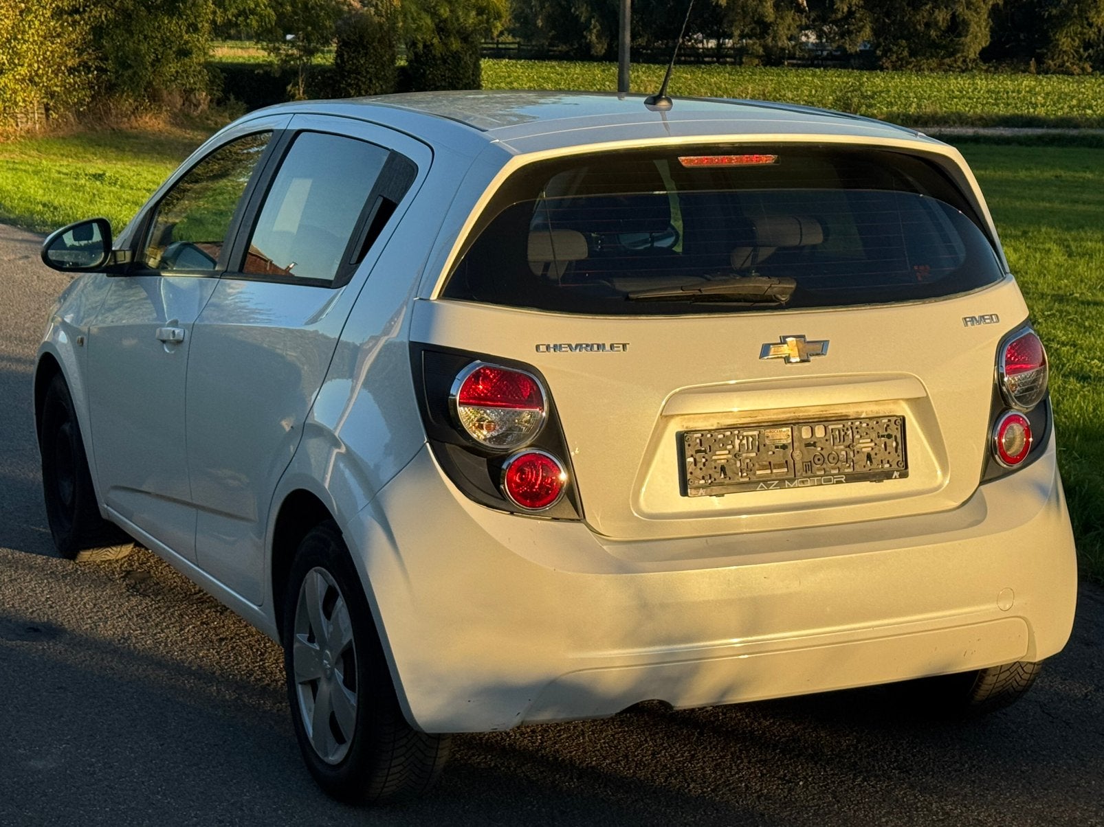 Chevrolet Aveo 1.2i 2013 Euro 5 Airco Full carnet 1Main Ctok, Stof, 120 cc, Wit, Bedrijf
