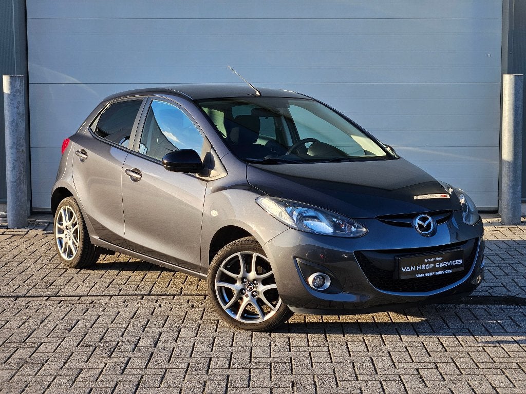Mazda 2 1.3i | 12M Garantie | Bluetooth | navi | airco, Auto's, Voorwielaandrijving, Stof, Zwart, 4 cilinders