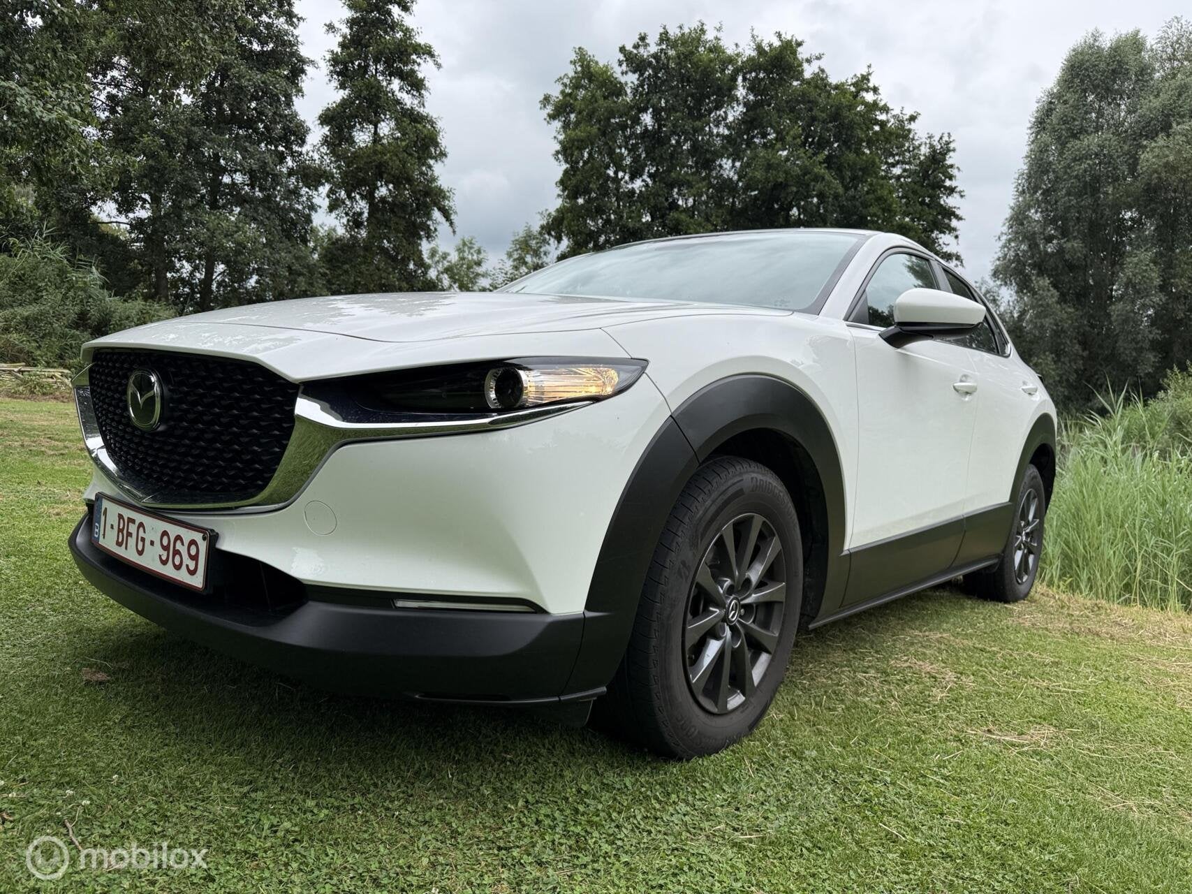 Mazda CX-30 2.5 mild Hybrid 2025 schade € 18.950,--, Wit, Handgeschakeld, Hybride Elektrisch/Benzine, Mazda