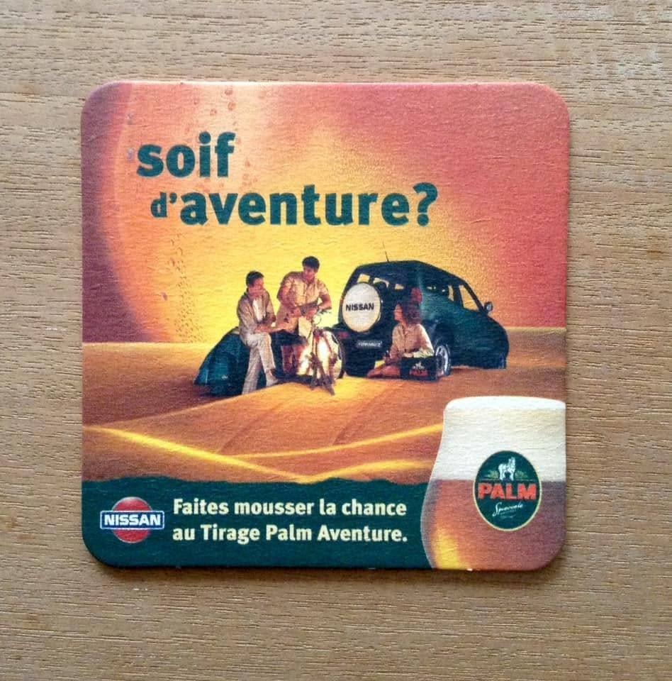 Sous-verre publicitaire Nissan Soif d'aventure, Collections, Marques de bière, Enlèvement ou Envoi, Neuf, Sous-bock, Palm