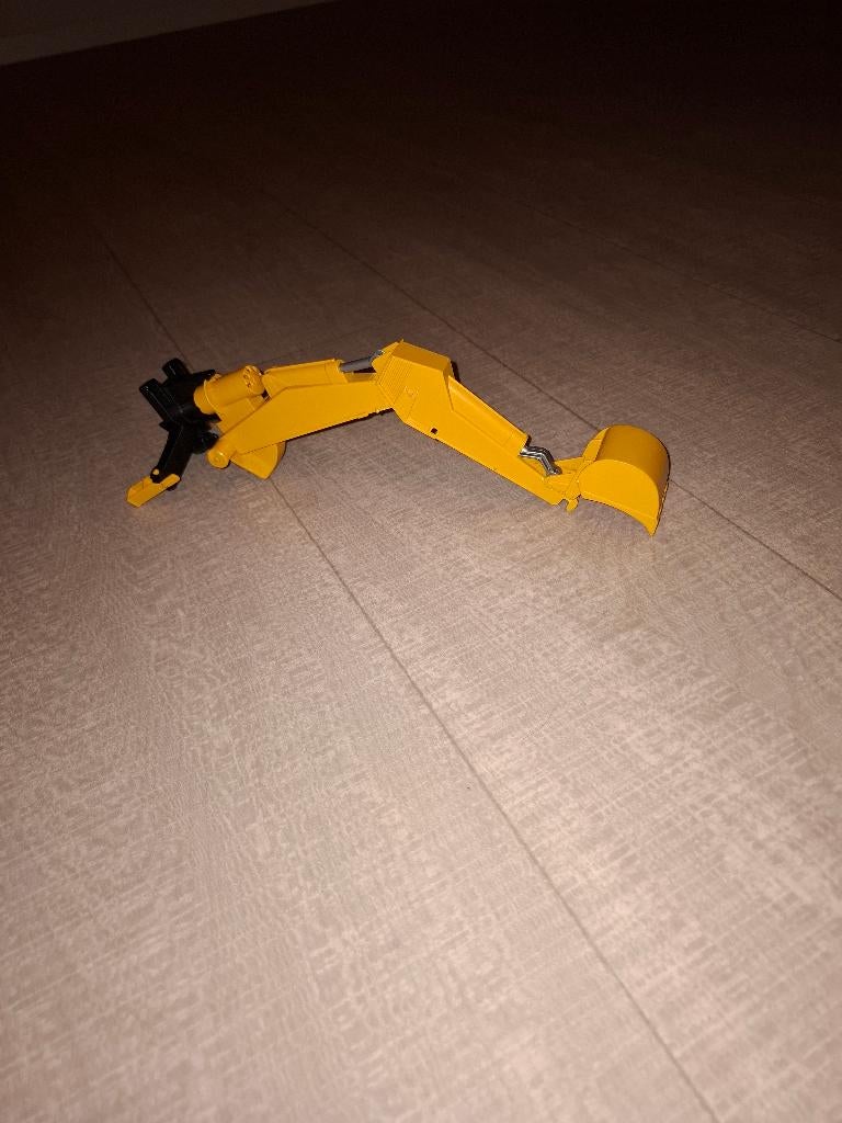 Bruder graafarm met grijper, Ophalen