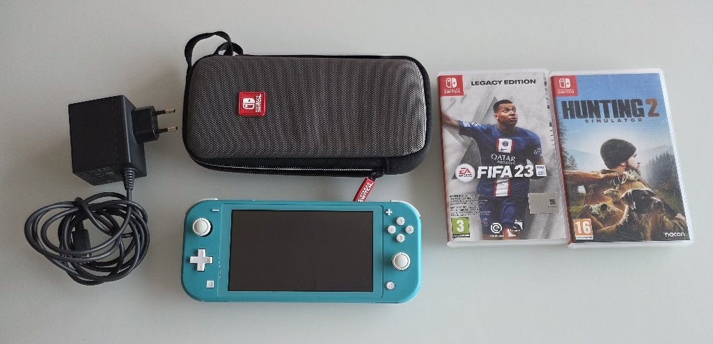 Nintendo Switch Lite console , lader, 2 spelletjes,opbergtas, Games en Spelcomputers, Ophalen of Verzenden