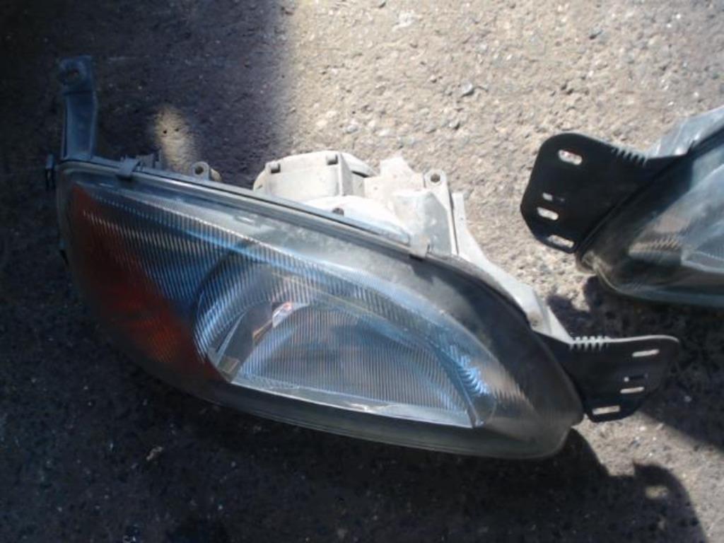 Optique avant gauche Mazda 121 3/2 1997-2002 LP/14630, Enlèvement, Utilisé, Mazda