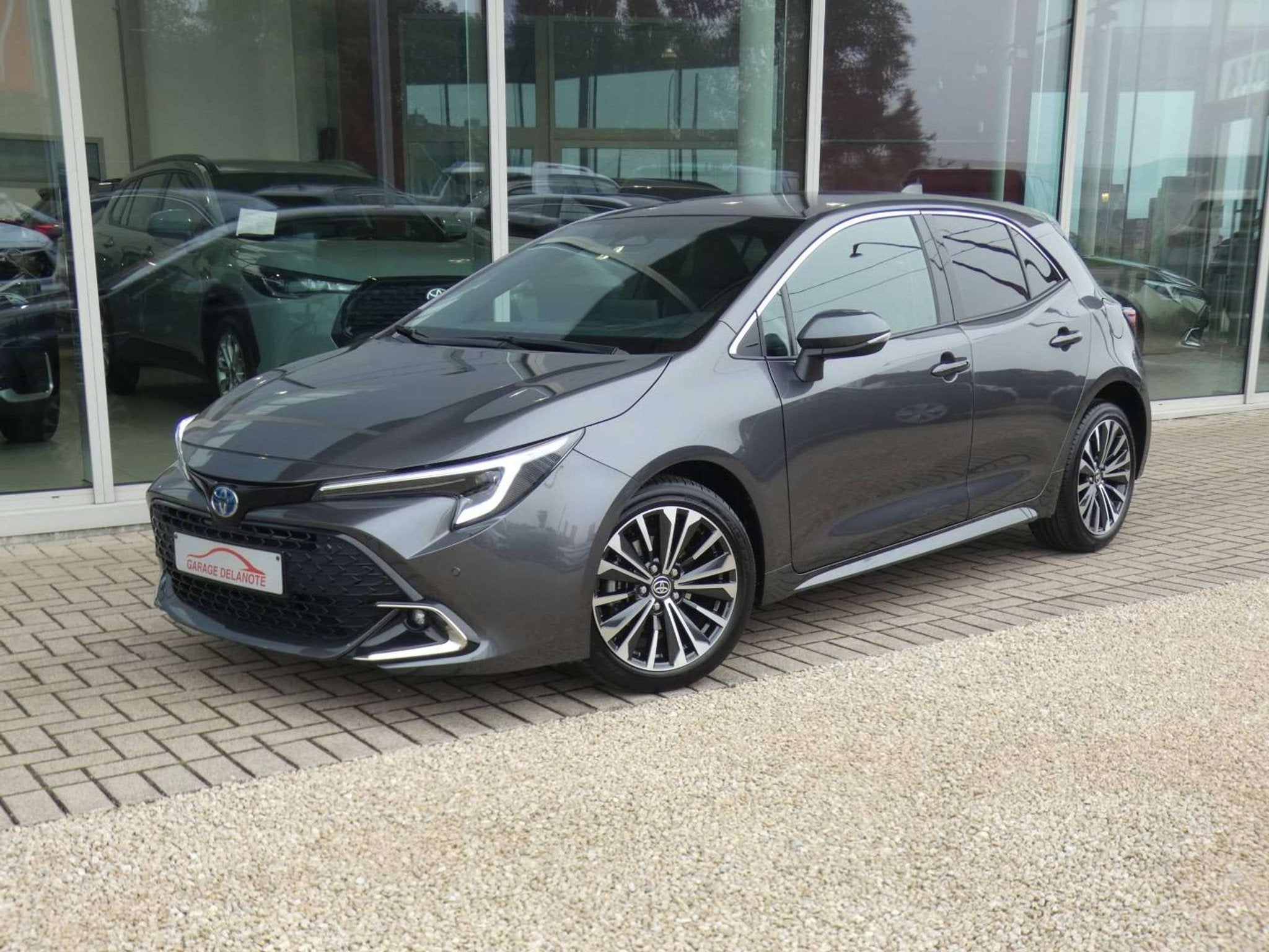 Toyota Corolla HB 1.8 Hybrid STYLE+TECH PACK 140pk +Dodehoek, Auto's, Gebruikt, Zwart, 4 cilinders, https://public.car-pass.be/vhr/8a83ce7c-d555-4ef8-9693-709e75e6d2bc