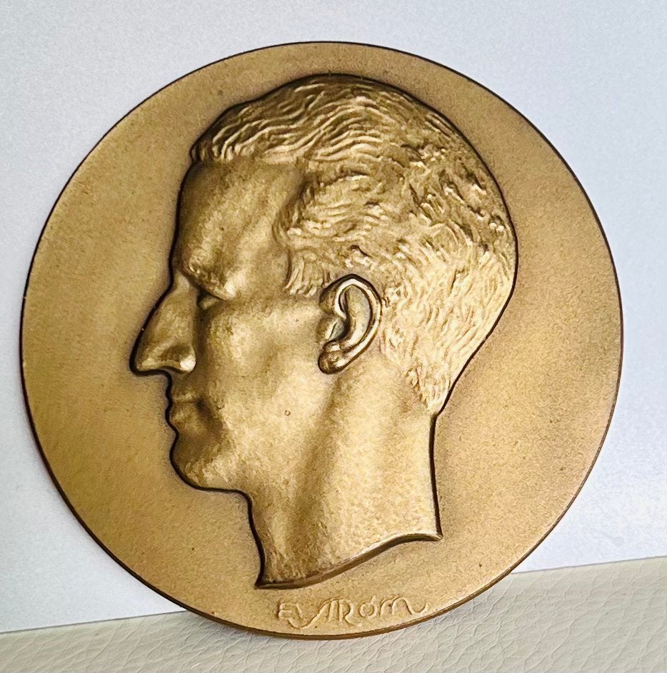 2 bronzen medailles, Ophalen