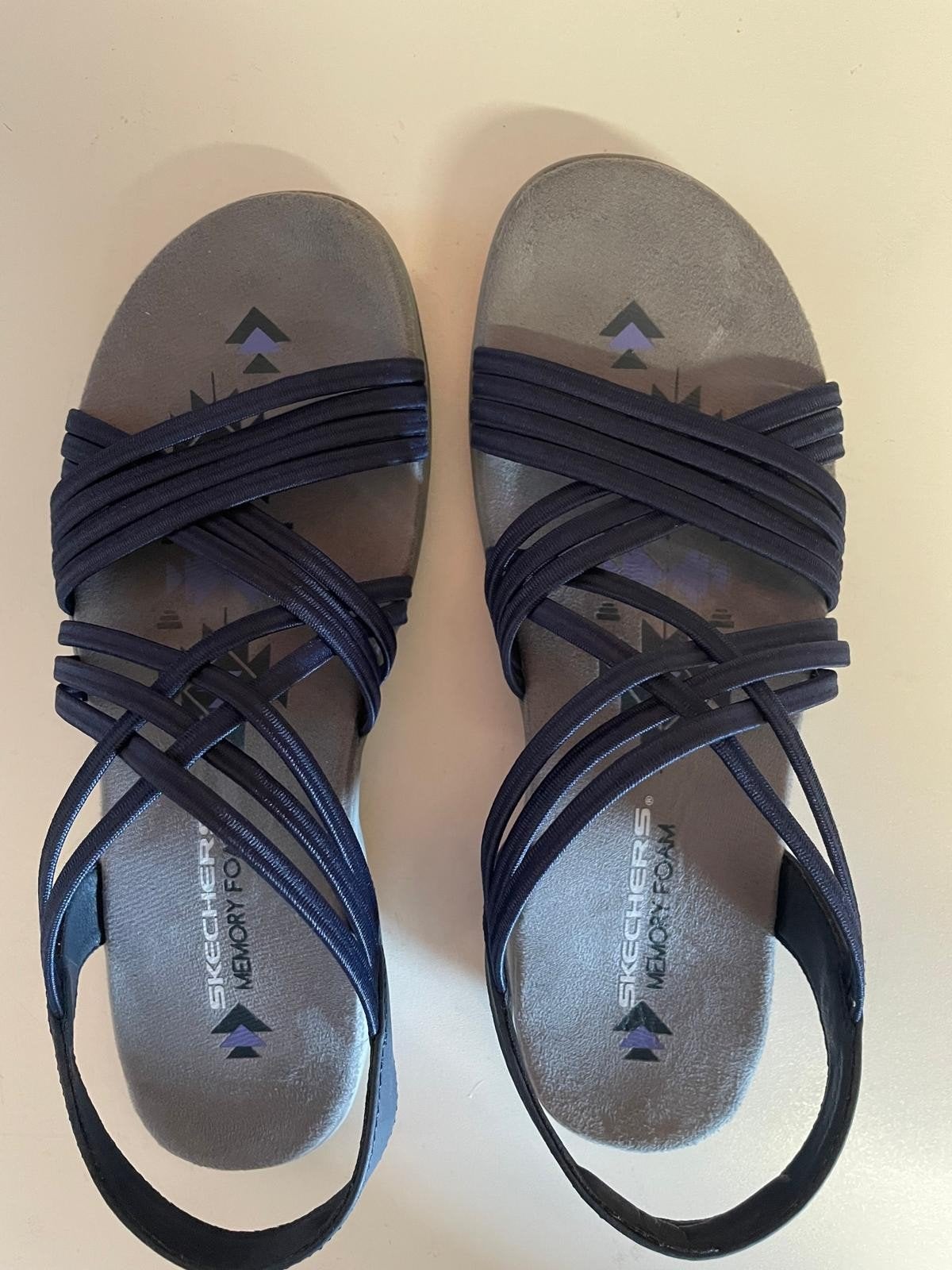Sandalen Skechers, Ophalen