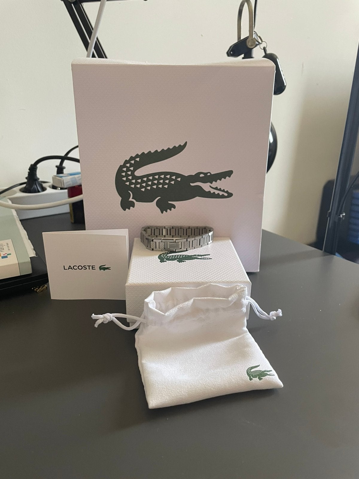 Lacoste amrband, Handtassen en Accessoires, Armbanden, Ophalen of Verzenden, Zo goed als nieuw, Zilver, Staal