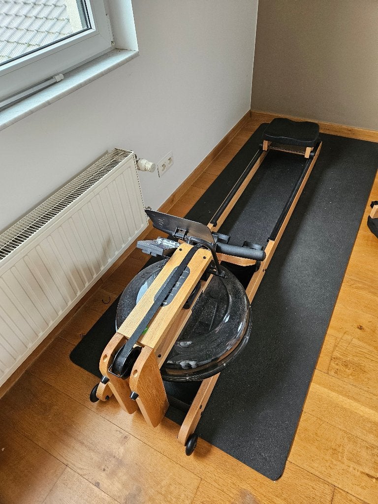 Roeitrainer inclusief zwarte beschermmat, Sport en Fitness, Ophalen, Overige materialen, Benen, Zo goed als nieuw