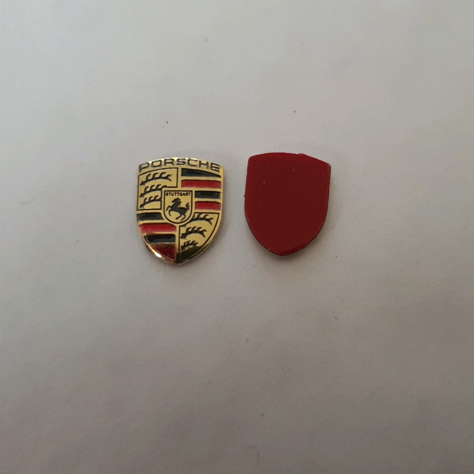 Porsche sleutel logo's  9 mm x 12 mm, Ophalen of Verzenden