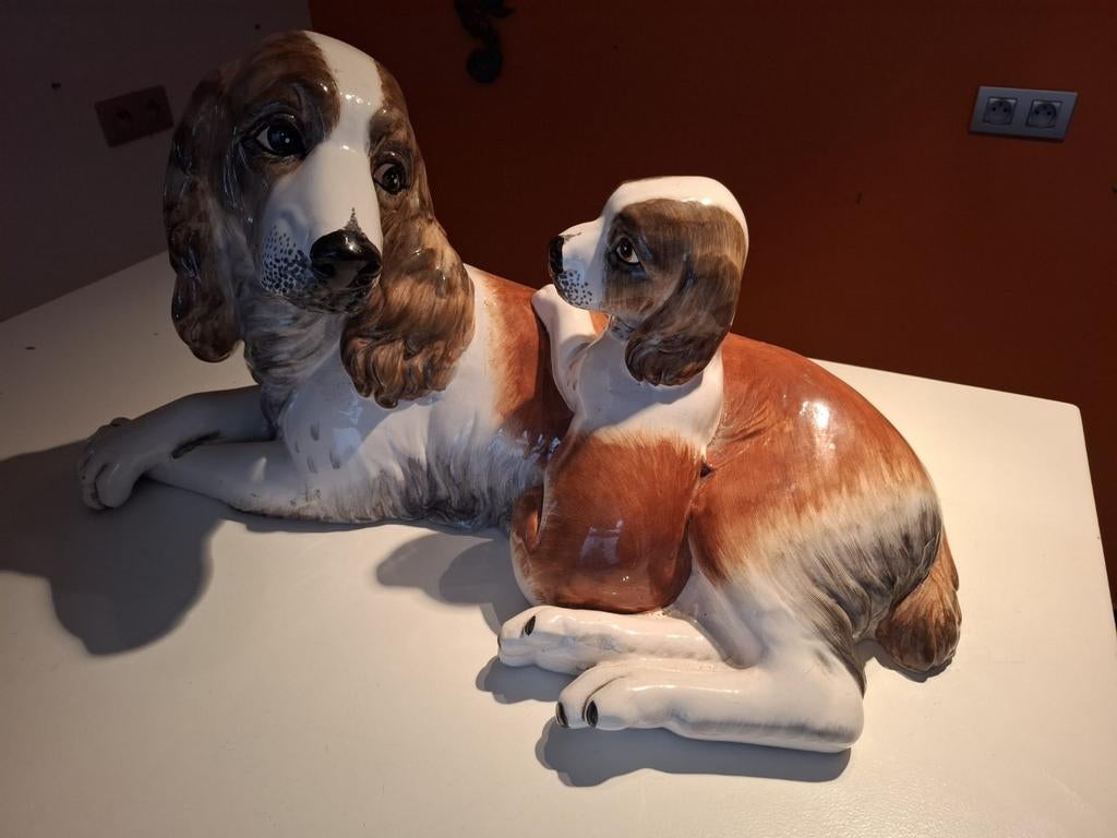 Hond met puppy beeld, Ophalen