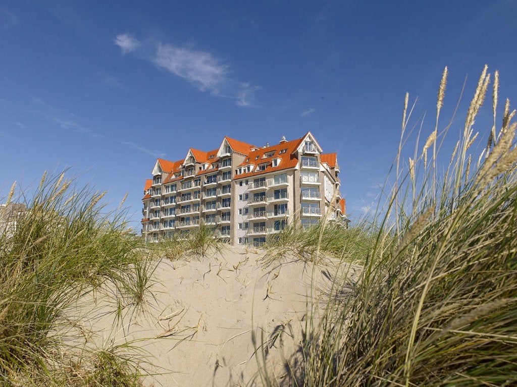 Frontaal zeezicht en zicht op de duinen Westende, Vacances