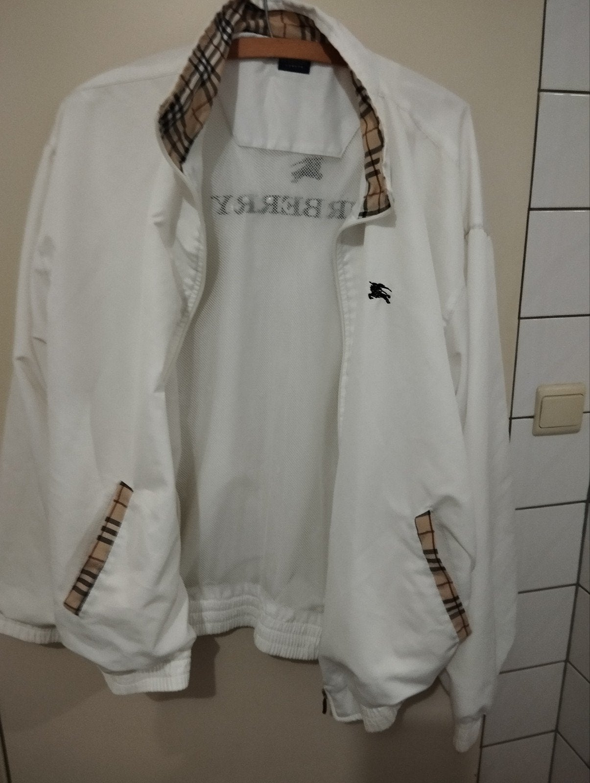 Zomervest burberry, Ophalen