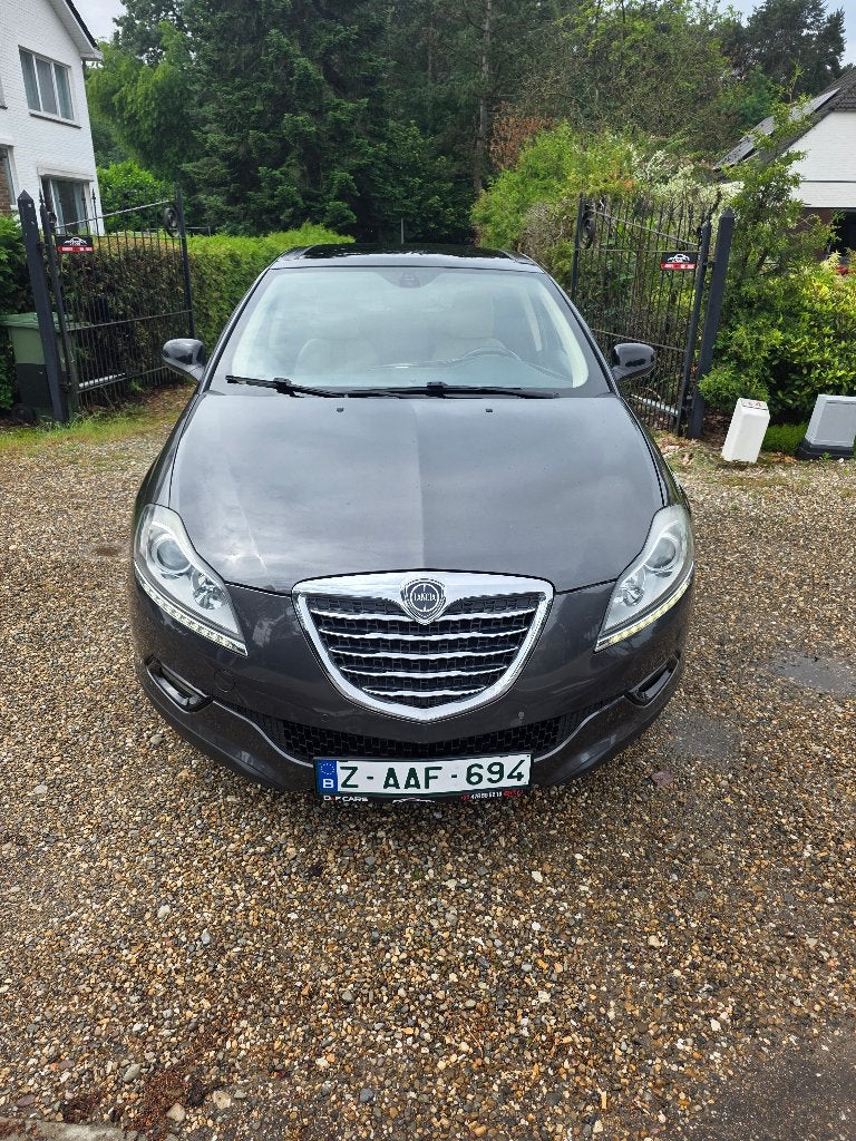 Lancia Delta 1.6 Mtj Automaat full optie 1ste eigenaar, Auto's, Beige, 4 cilinders, Leder, Bedrijf