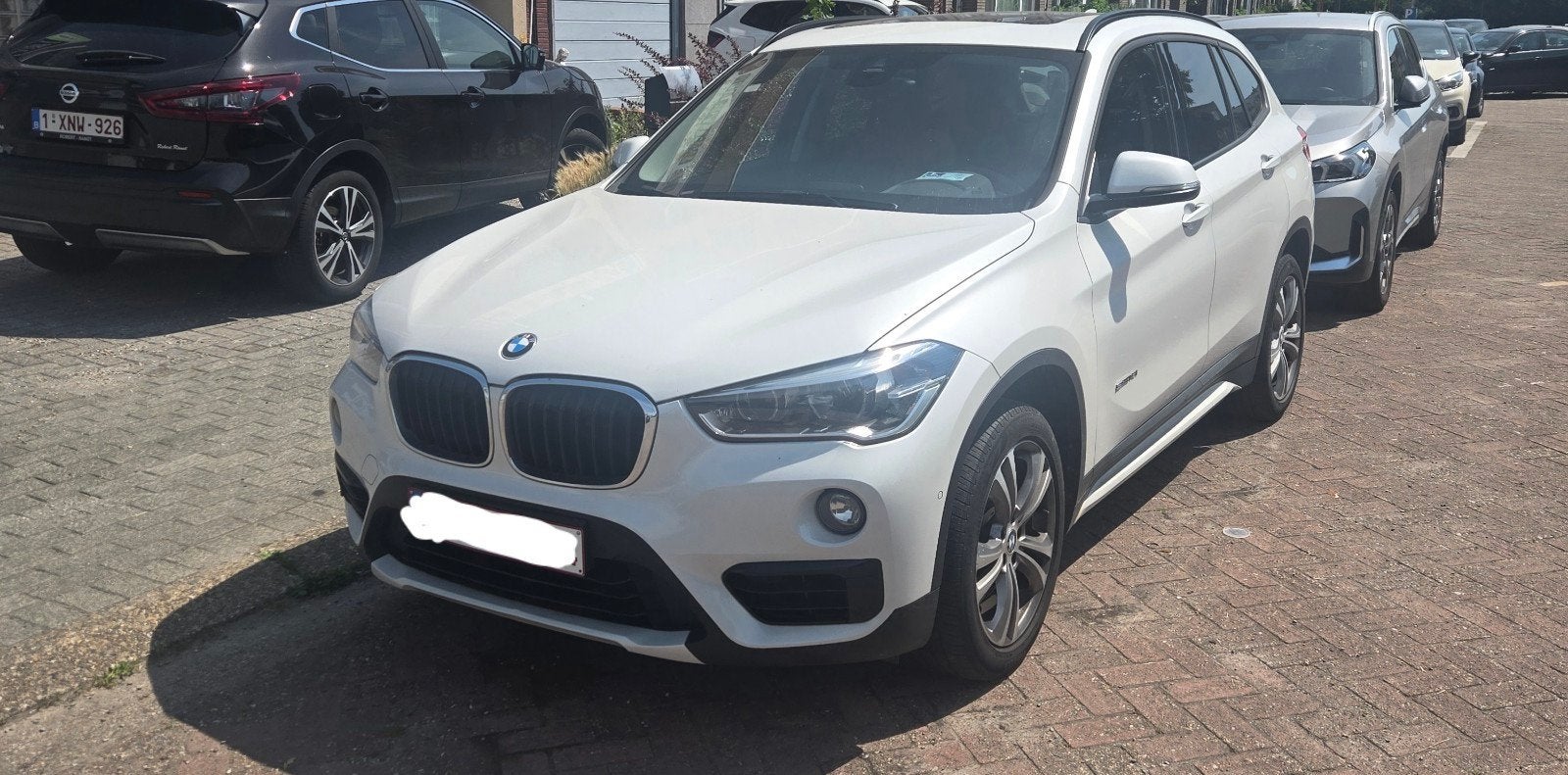 Bmw X1 bj 2017 benzine, Auto's, BMW, Stof, Open dak, Zwart, Wit