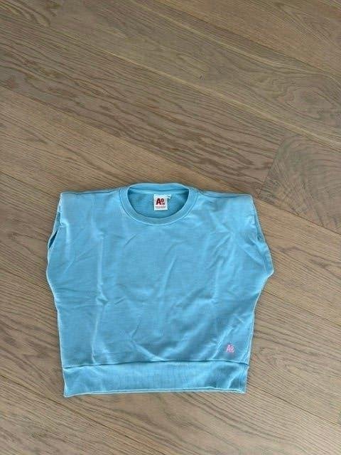 AO76 t-shirt lichtblauw 10jaar   NIEUW, Enfants & Bébés, Vêtements enfant | Taille 140, Neuf, Enlèvement ou Envoi, Chemise ou À manches longues