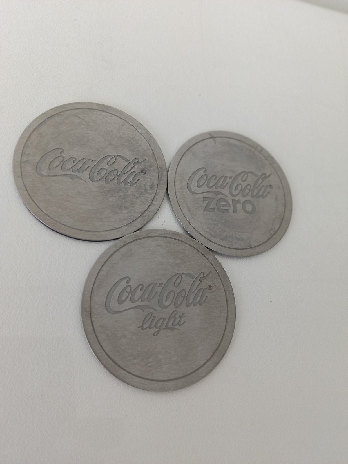 3 verschillende onderzetters: Coca-Cola, cola zero en light, Ophalen