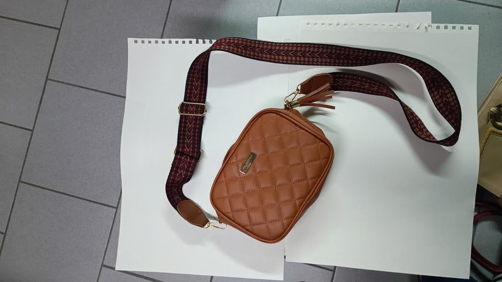Sac bandoulière, Ophalen