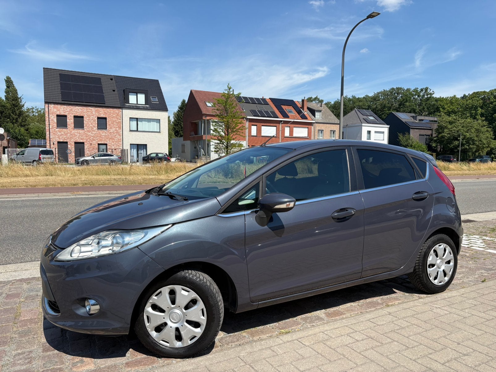 Ford Fiesta | 12 M Garantie | 117 Dkm | Benzine | 2012 |, Stof, Zwart, 4 cilinders, Spraakbediening