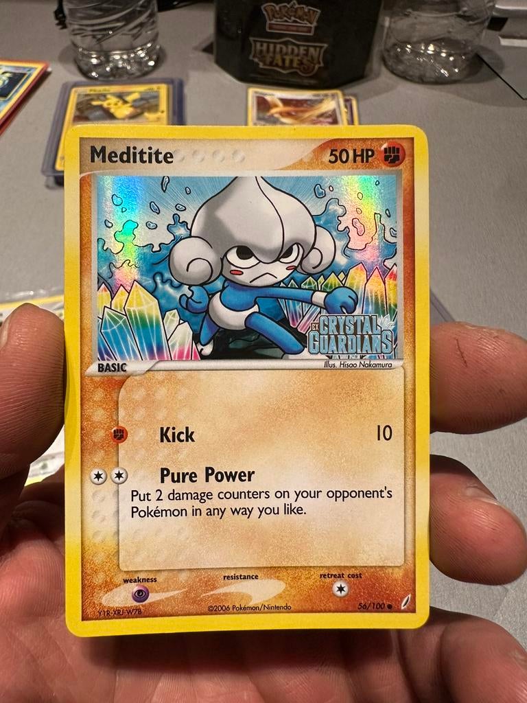 Pokémon Meditite 56/100 Ex Crystal Guardians holo stalmped, Ophalen of Verzenden, Zo goed als nieuw, Losse kaart