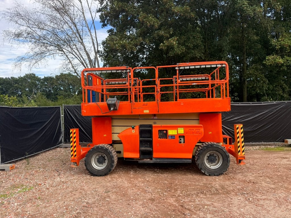 JLG 4394RT Schaarlift 15m 44 Diesel, Ophalen