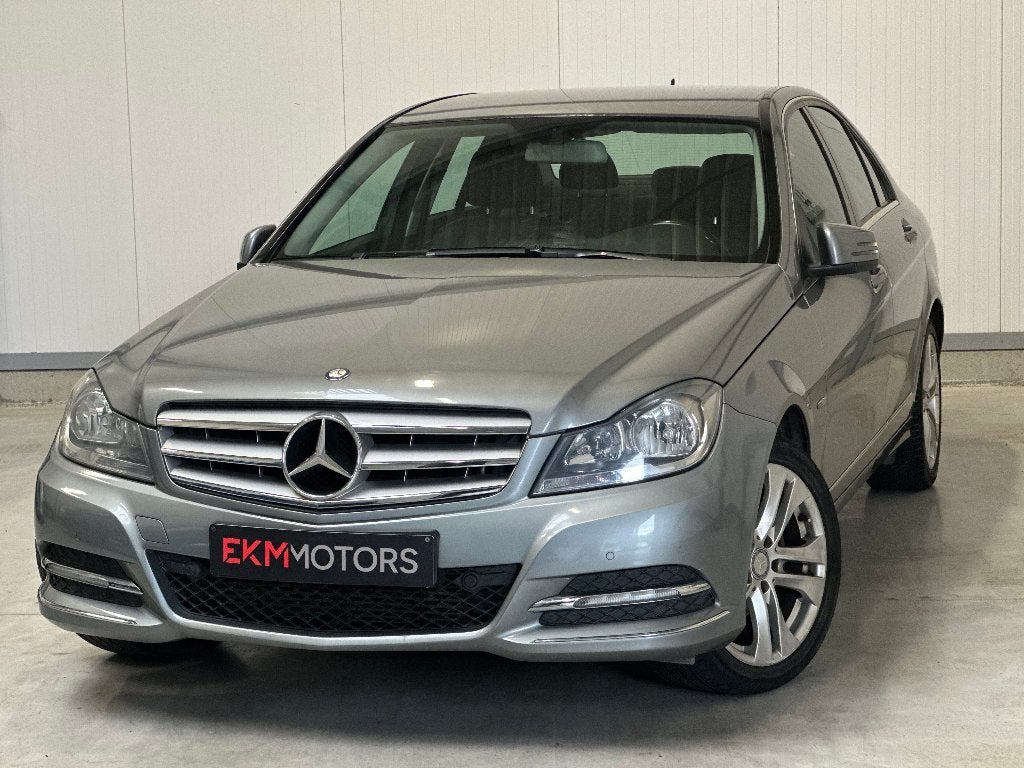 Mercedes C180 / Benzine / Automaat / Airco / Navi, Auto's, Automaat, Euro 5, Zwart, Bedrijf