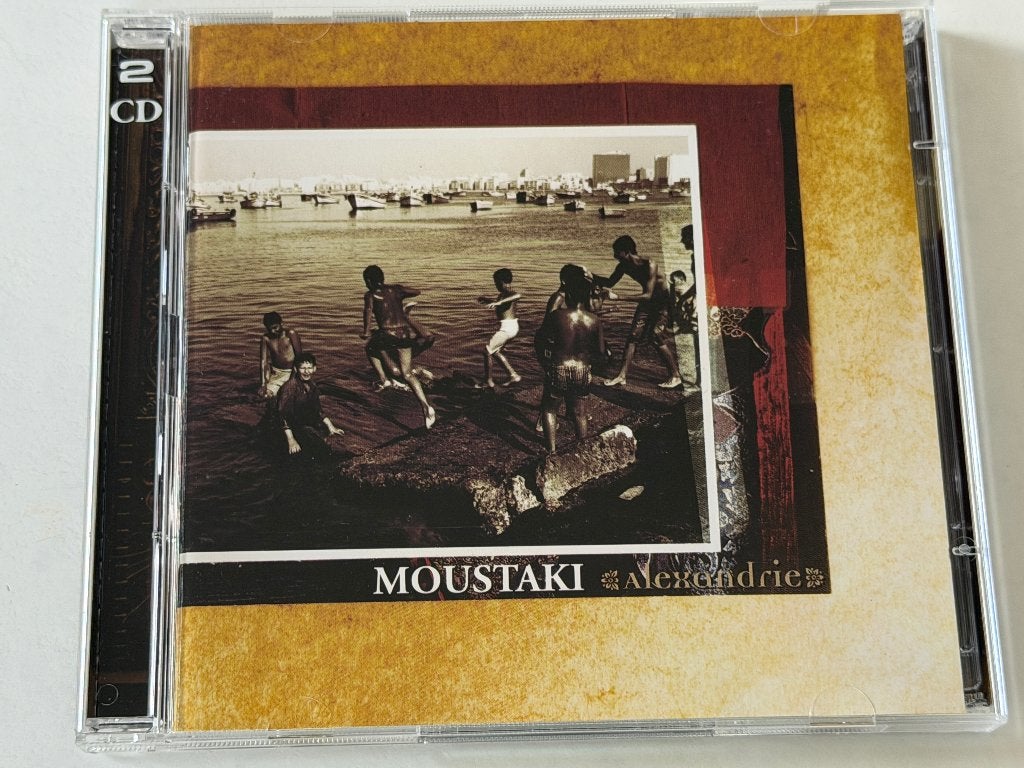 Georges Moustaki – Alexandrie: Initiation Au Voyage (CD/DVD), Cd's en Dvd's, Ophalen of Verzenden, Chanson, Album, Gebruikt