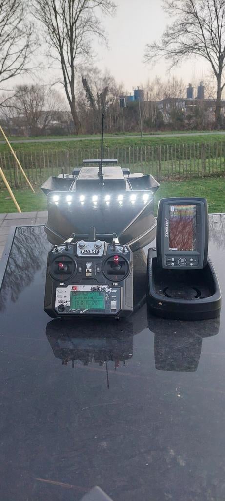 Voerboot met hook release en dieptemeter, Enlèvement
